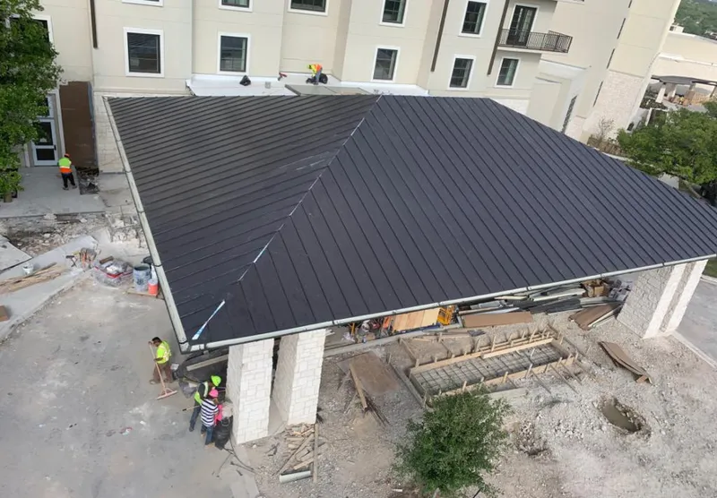 Metal roofing installation team working on a commercial building in Sebastopol