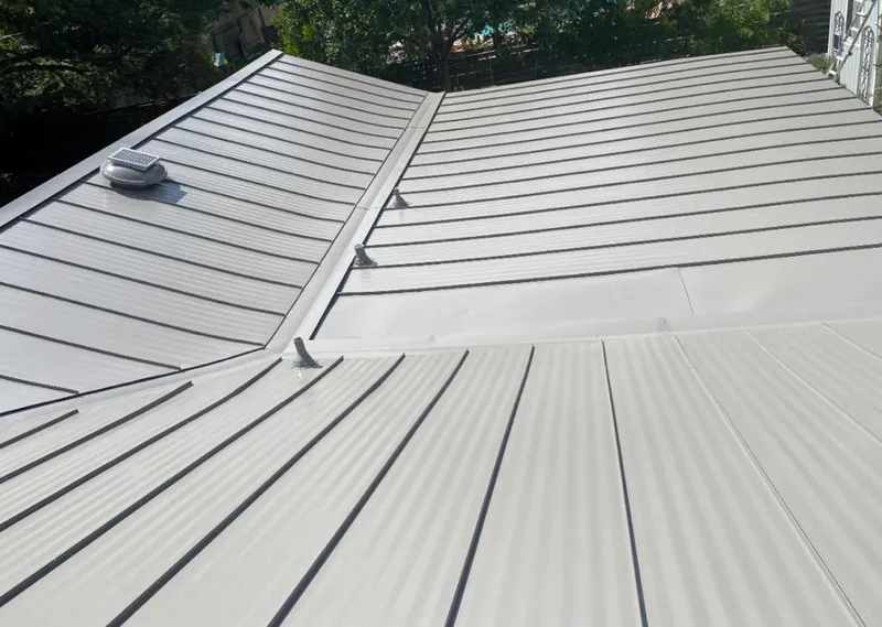 Solar attic fan installed on a metal roof for Roof Ventilation in Sebastopol